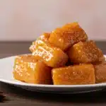 Homemade candied yams served with cinnamon and star anise
