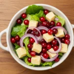 Festive Christmas cranberry salad in a white bowl