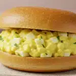 Egg salad sandwich on a bun