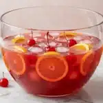 Bowl of Shirley Temple Punch with oranges and cherries