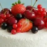 Cottage cheese dessert topped with fresh berries and currants