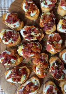 A platter of goat cheese appetizers with honey, nuts, and herbs