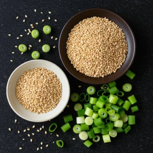 A bowl of Din Tai Fung cucumber salad, featuring crisp cucumber slices coated in a savory garlic-soy dressing with sesame seeds and chili oil.