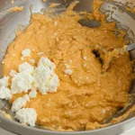 Creamy Cottage Cheese Buffalo Chicken Dip served in a bowl with fresh veggies and chips.