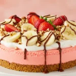 No-bake banana split cheesecake topped with fruit and chocolate