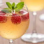 Raspberry limoncello sparkler mocktail in a stemmed glass