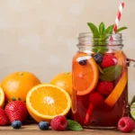 Colorful fruit riot summer drink in a mason jar with citrus and berries